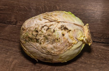Photo for Rotten spoiled cabbage on the table - Royalty Free Image