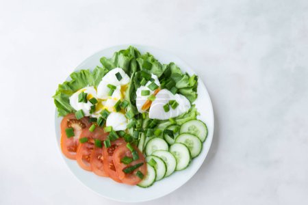 Photo for Dive into a Keto-Friendly Morning with Poached Egg and Vibrant Veggies - Royalty Free Image
