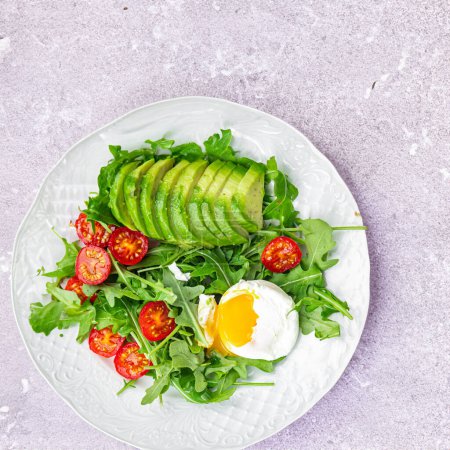 Photo for Poached Egg Crowns a Refreshing Avocado Salad - Royalty Free Image