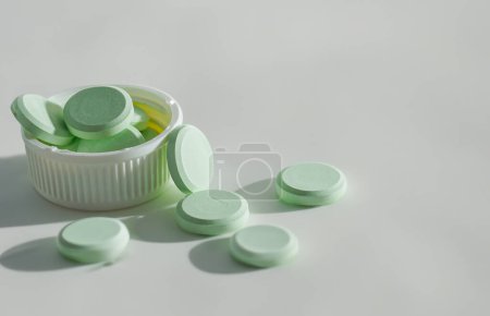 Photo for Pile of pills with green tablets, background - Royalty Free Image