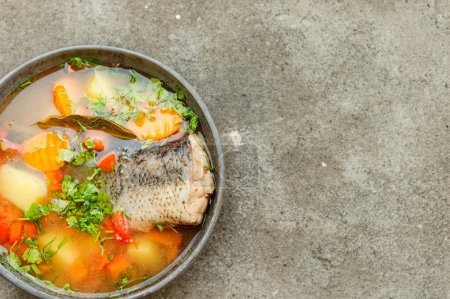 Photo for 1 Homestyle fish soup on vintage table - Royalty Free Image