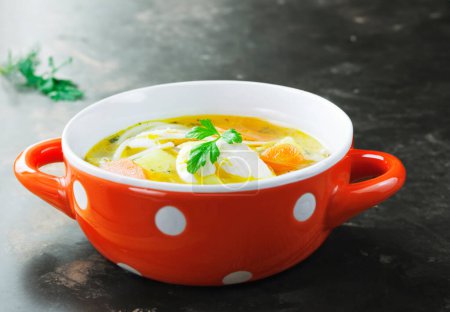Photo for Savoring a bowl of comforting chicken soup - Royalty Free Image