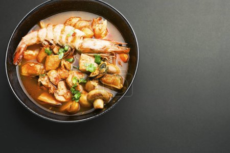 Photo for Spicy Thai seafood soup, tom yam kung, in a bowl - Royalty Free Image
