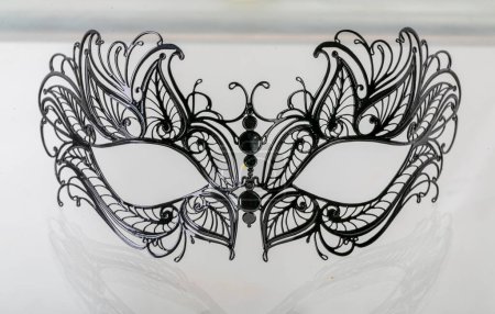 Foto de Black Venetian style metal mask. High quality photo - Imagen libre de derechos