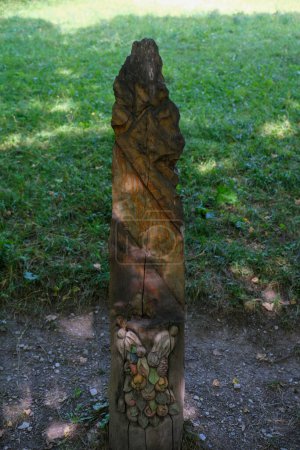 Photo for Bardonecchia, Turin, carved wooden statues in the forest path that runs alongside the river. High quality photo - Royalty Free Image