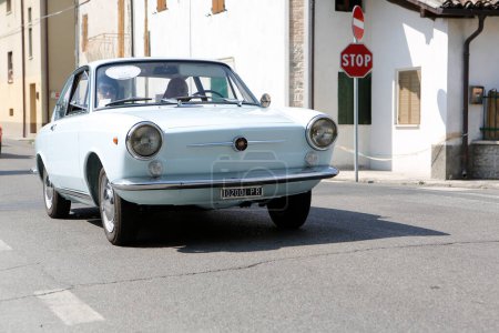 Photo for Bibbiano-Reggio Emilia Italy - 07 15 2015 : Free rally of vintage cars in the town square Fiat 850 Coupe. High quality photo - Royalty Free Image