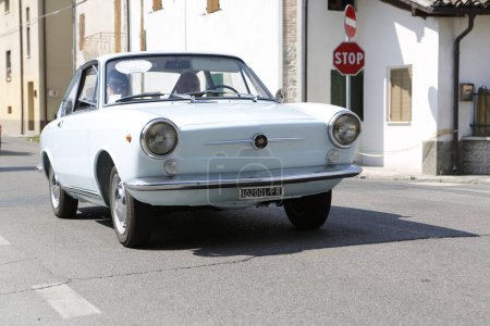 Photo for Bibbiano-Reggio Emilia Italy 07 15 2015 Free rally of vintage cars in the town square Fiat 850 Coupe. High quality photo - Royalty Free Image