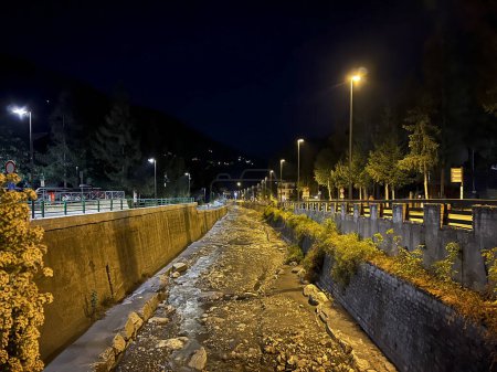 Photo for Bardonecchia Turin canal of the Dora river that passes through the city night photo. High quality photo - Royalty Free Image