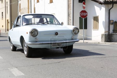 Photo for Bibbiano-Reggio Emilia Italy 07 15 2015 Free rally of vintage cars in the town square Fiat 850 Coupe. High quality photo - Royalty Free Image