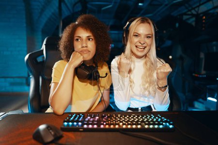 Two gamers share diverse reactions during a gaming session. High quality photo
