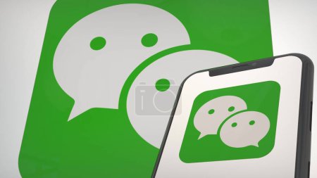Téléchargez les photos : Logo de l'application WeChat dans l'écran d'affichage mobile et l'éditorial d'arrière-plan - en image libre de droit