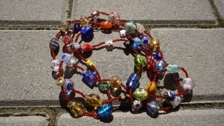 Beaded colorful summer necklace on the ground