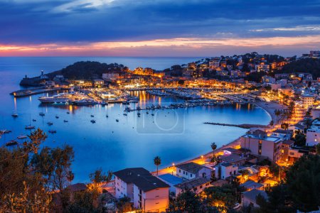 Photo for Port de Soller during sunset. Beautiful dusk at travel destination in Mallorca, Spain. Illuminated old town of the Balearic Islands - Royalty Free Image