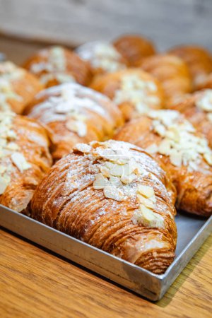 Photo for Ready-made croissants on baking sheet - Royalty Free Image