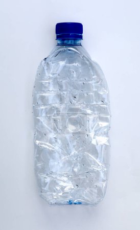 Photo for Crumpled blue plastic bottle isolated on white - Royalty Free Image