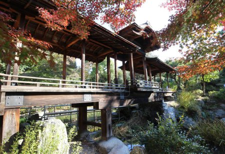 Photo for Kaitourou (roofed corridor) and autumn leaves in Shosei-en Garden, Kyoto, Japan - Royalty Free Image