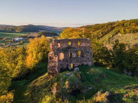 Photo for An old ruins of a medieval castle in Mestecko Trnavka with mountains in the background. Moravia, Czech republic. - Royalty Free Image
