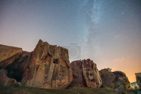 Photographs of the Phrygian valley and rock forms in the Afyon province at night under the Milky Way and the stars