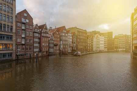 Germany's second largest city Hamburg streets canals and symbolic buildings snow and colorful cloudy sky and daylight in winter