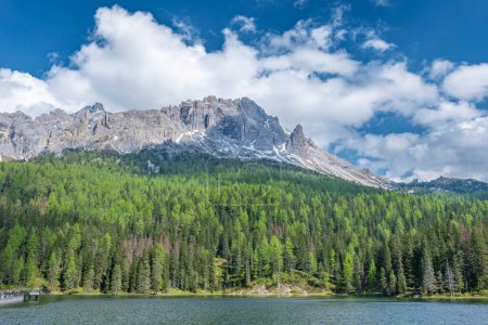 italian alps dolomites national park lake mountain trekking peaks tre cime brais lake carezza lake reflection clouds