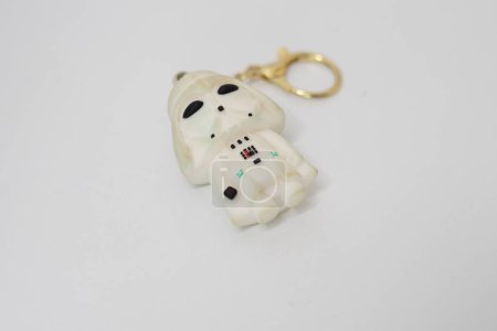 Photo for Veder dart display toy intended as a key chain with a white body - Royalty Free Image