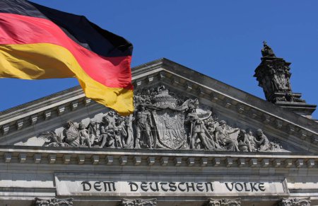 Photo for Reichstag in Berlin with German flag - Royalty Free Image