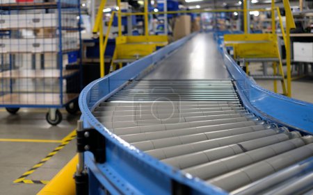 Photo for Conveyor belt inside a manufacturing site or distribution warehouse - Royalty Free Image