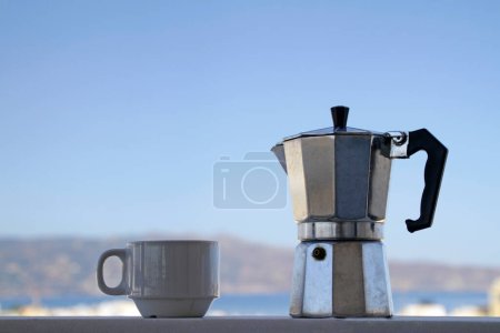 Photo for Morning coffee with the blue sky in Heraklion, Crete, in the background - Royalty Free Image