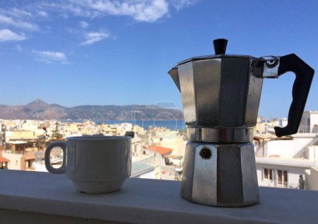 Photo for Morning coffee with the blue sky in Heraklion, Crete, in the background - Royalty Free Image