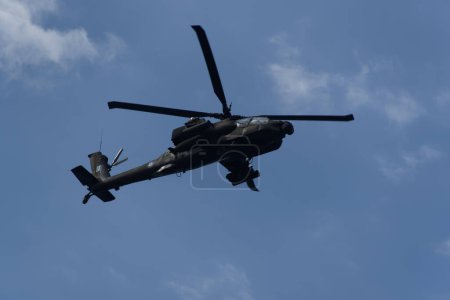 Photo for Thessaloniki, Greece - October 28 2022: Boeing AH-64 attack helicopter on formation during an air show. Greek Air Force Apache flying during the 28 October National Oxi Day parade. - Royalty Free Image