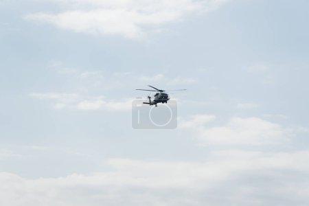 Photo for Thessaloniki, Greece - October 28 2022: Sikorsky Seahawk naval military helicopter during an air show. Hellenic Navy S-70 flying during the 28 October National Oxi Day parade. - Royalty Free Image