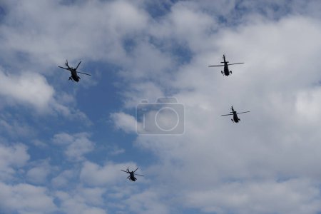 Photo for Thessaloniki, Greece - October 28 2022: Kiowa Warrior helicopters during an air show. Greek Air Force Bell OH-58 flying during the National Oxi Day parade. - Royalty Free Image