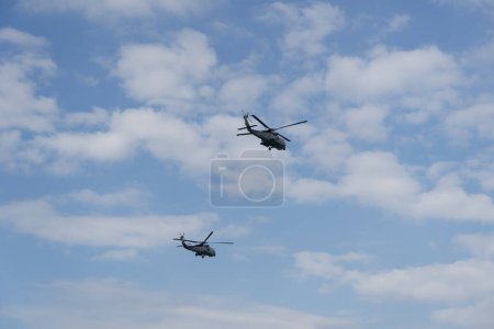 Photo for Thessaloniki, Greece - October 28 2022: Sikorsky Seahawk naval military helicopters during an air show. Hellenic Navy S-70 flying during the 28 October National Oxi Day parade. - Royalty Free Image