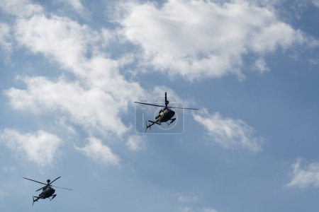 Photo for Thessaloniki, Greece - October 28 2022: Kiowa Warrior helicopters during an air show. Greek Air Force Bell OH-58 flying during the National Oxi Day parade. - Royalty Free Image