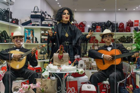 Photo for Lisbon, Portugal - July 18 2918: shop window showcase of dummies depicting a Fado singer accompanied by musicians playing a classic and Portuguese guitar. - Royalty Free Image