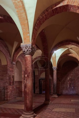 Architectural detail with arches and pillars inside Santo Stefano complex, part of Sette Chiese, the Seven Churches in Bologna, Italy.