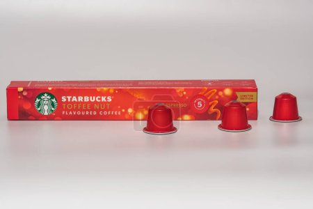 Photo for Thessaloniki, Greece - November 20 2023: Nespresso machine Starbucks Toffee Nut Christmas Limited Edition aluminium pods with box and logo, used to create espresso-dripping coffee. - Royalty Free Image