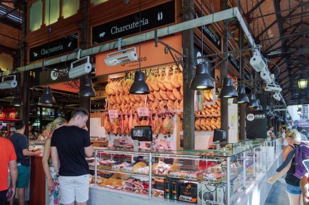 Photo for Madrid, Spain - July 22 2017: fresh food market, Mercado de San Miguel interior with Jamon and cold cuts for sale. - Royalty Free Image