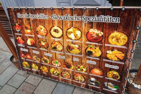 Bratislava, Slovakia - April 13 2019: Local food menu chart display with descriptions outside a Slovak restaurant.