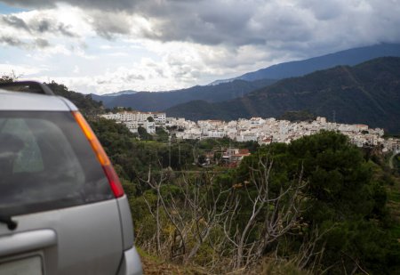 Photo for View of a white village from a car in the municipality of Istan in the Sierra de las nieves, Malaga province, Andalusia, Spain. - Royalty Free Image