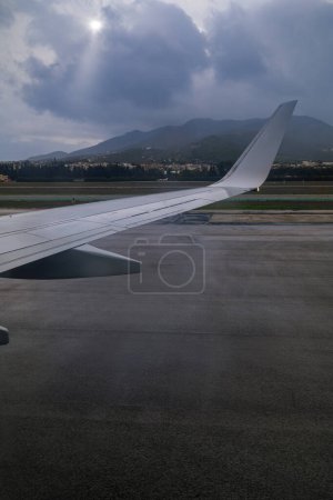 View from the window of an aircraft preparing for takeoff from the airport runway.