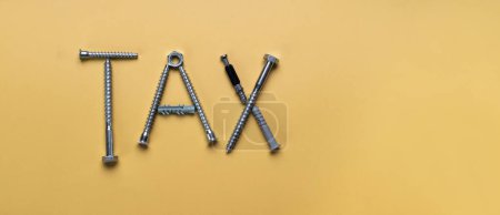 Photo for Sign Tax, frame with copy space made of bolts, screws. Banner on yellow plain background - Royalty Free Image