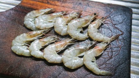 Fresh prawn cleaned on cutting board. Raw shrimps are healthy seafood
