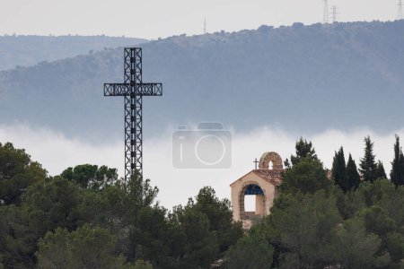 Landscape with low clouds after the top of the San Cristobal peak in Alcoy, Spain