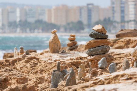 Stone cairns on the beach of the Agua Amarga salt marsh, Alicante, Spain
