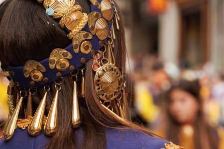 Unrecognizable woman's helmet in the Moors and Christians parade in Alcoy, Spain