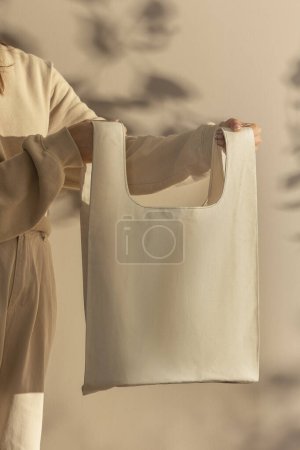 Photo for Person holding blank paper bag - Royalty Free Image