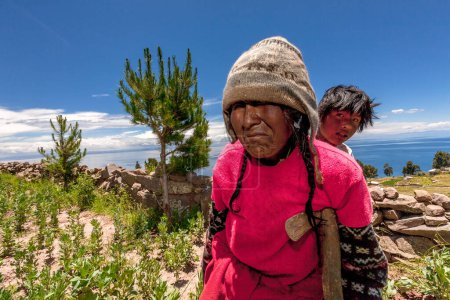 Photo for March 8, 2017, Taquile Puno, Peru: Taquile Island people walking along the path - Royalty Free Image