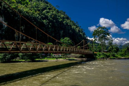 Photo for Suspension bridge in the jungle over the mountain river - Royalty Free Image
