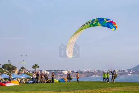 Photo for A paraglider flying over the blue sky in the background. kite surfing in the sea, Miraflores Lima - Royalty Free Image